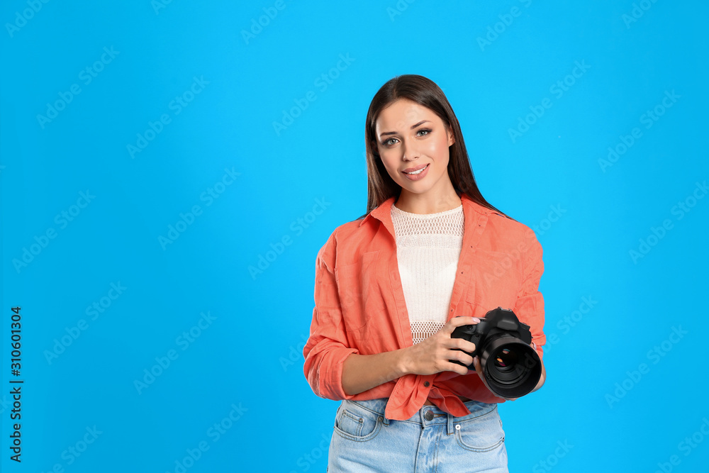 Professional photographer working on light blue background in studio. Space for text