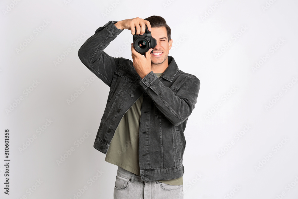 Professional photographer working on white background in studio Professional photographer working on white background in studio