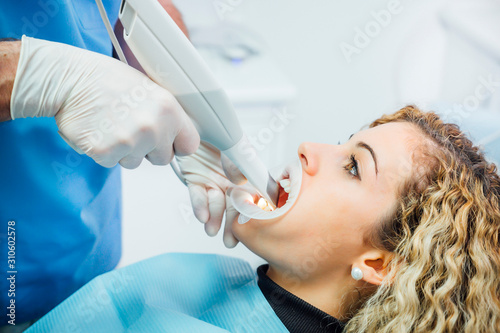 Dentist using innovative 3d ultrasound for dental check