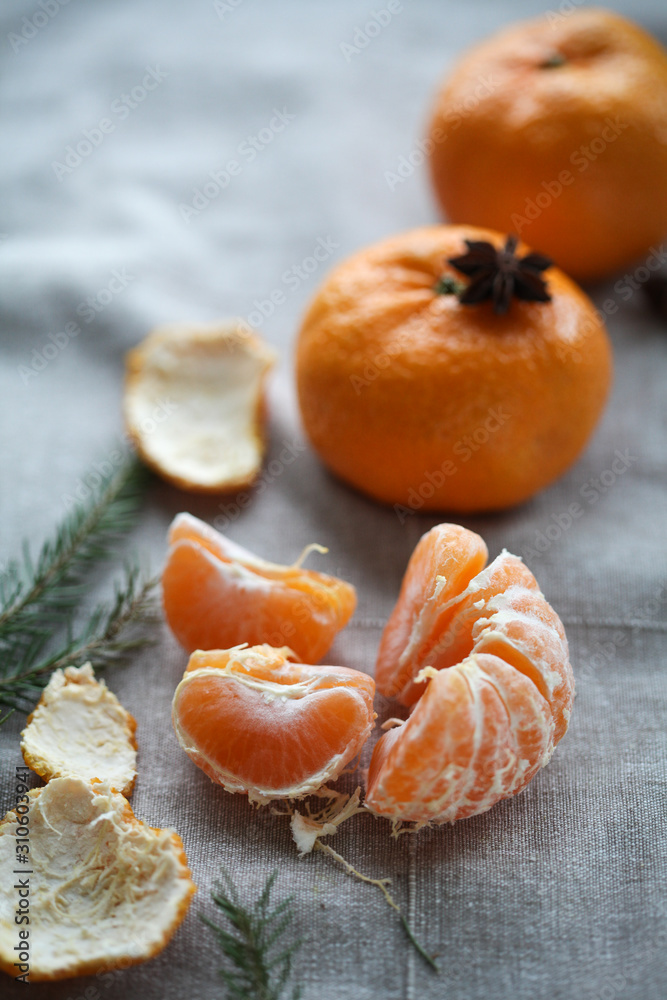 ripe peeled mandarin on a gray background, star anise. For calendar, background ripe peeled mandarin on a gray background, star anise. For calendar, background