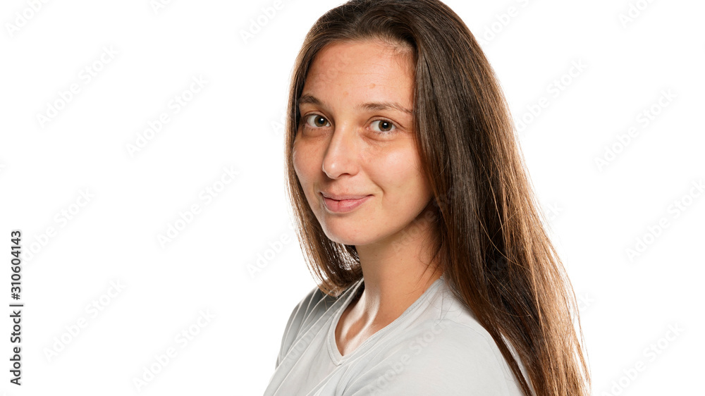 Portrait of young smiling woman without makeup on white background Portrait of young smiling woman without makeup on white background