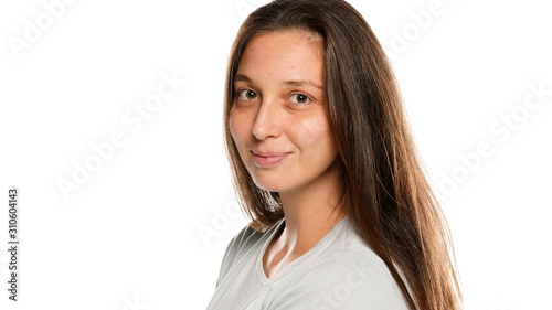 Portrait of young smiling woman without makeup on white background © vladimirfloyd