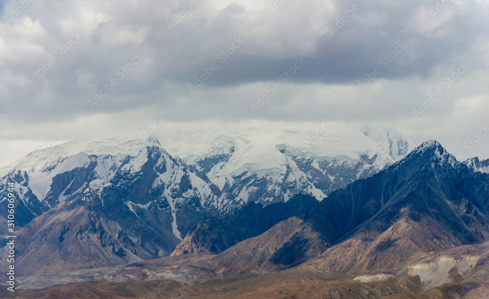 Panoramic view of snow capped mountain range peak Panoramic view of snow capped mountain range peak
