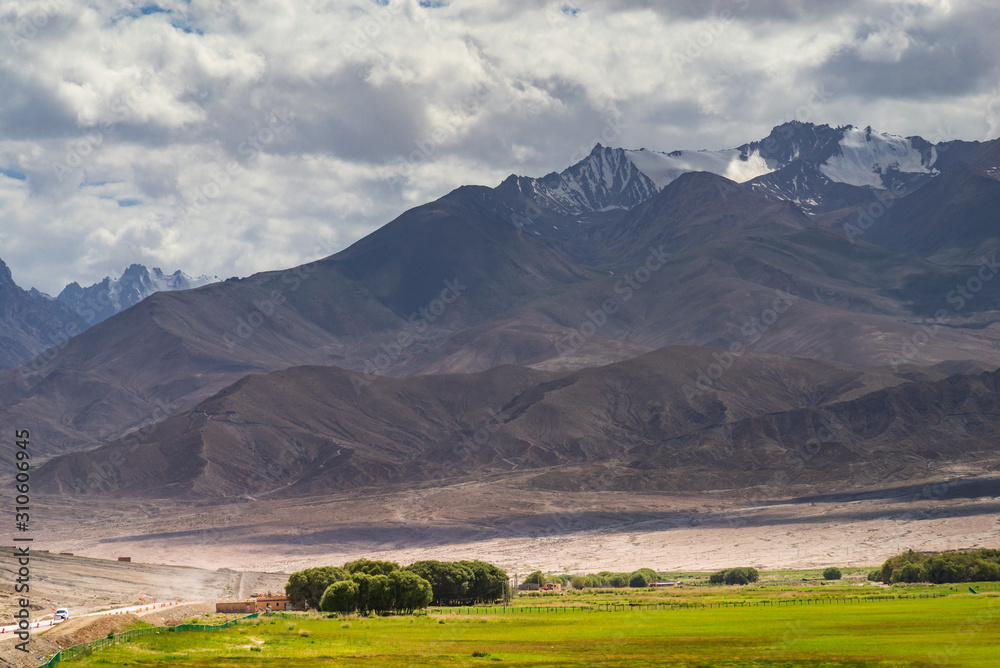 Mountain ranges,desert,pasture and cloudscape