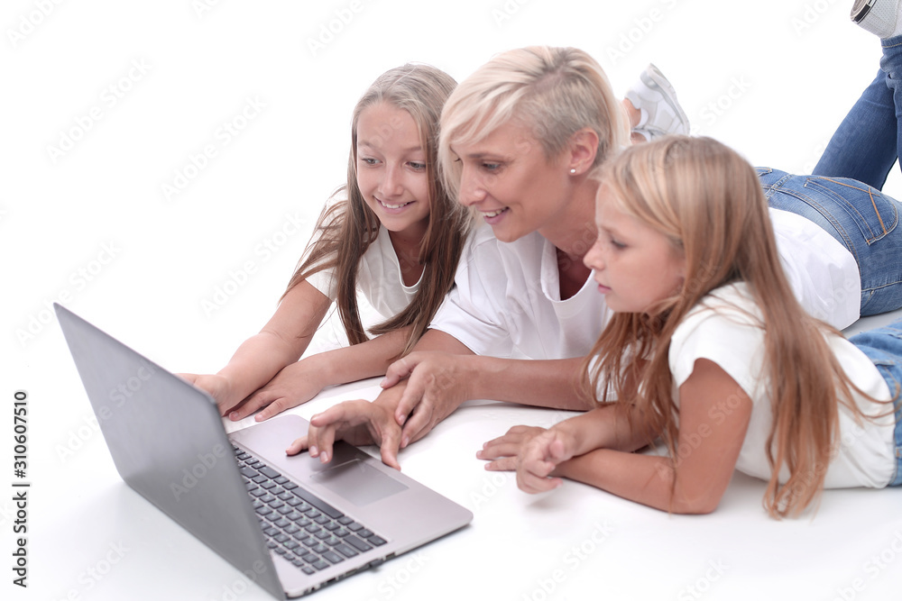 close up. mom and daughters watching a movie on a laptop close up. mom and daughters watching a movie on a laptop