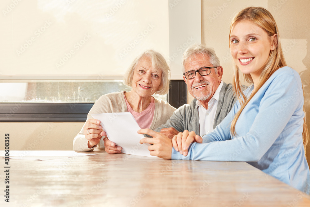 Daughter and seniors with contract of insurance Daughter and seniors with contract of insurance