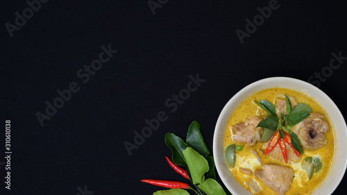 Top view of Thai chicken green curry on black desk background