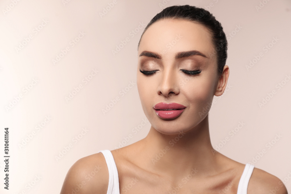 Beautiful woman with pink lipstick on light background Beautiful woman with pink lipstick on light background
