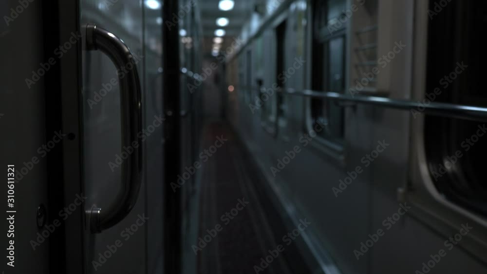 Inside the train car. Empty train at night. Railway carriage. Strong shaking. Corridor, passenger carriage interior. Long journey. Tourist trip. A terrible, creepy deserted place. Low light. Fear. Inside the train car. Empty train at night. Railway carriage. Strong shaking. Corridor, passenger carriage interior. Long journey. Tourist trip. A terrible, creepy deserted place. Low light. Fear.
