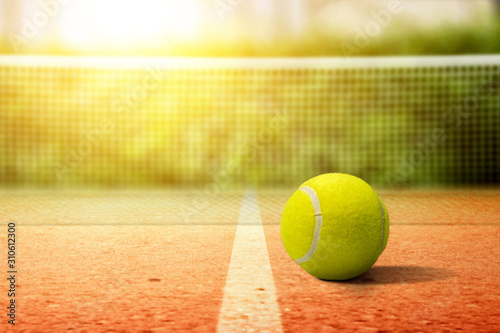 Closeup view of a tennis ball on the tennis court © Leo Lintang
