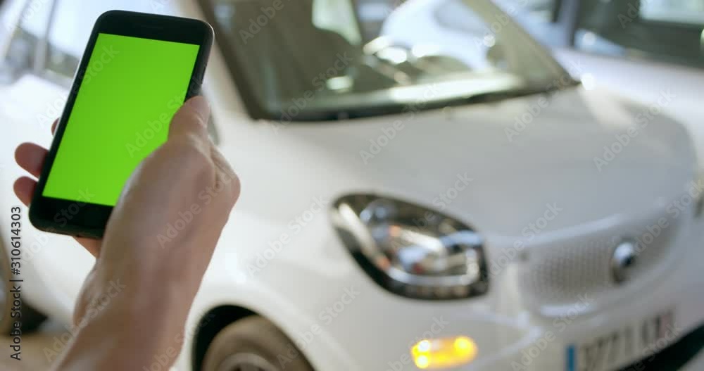 Man opens rental electric sharing car with phone