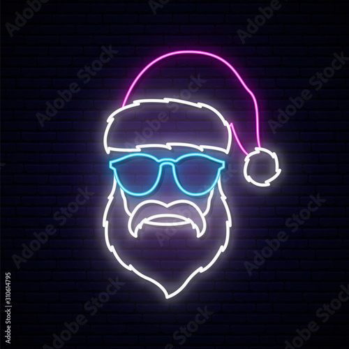 Santa Claus in blue sunglasses neon sign. Bright light signboard with man in Santa Claus purple hat.