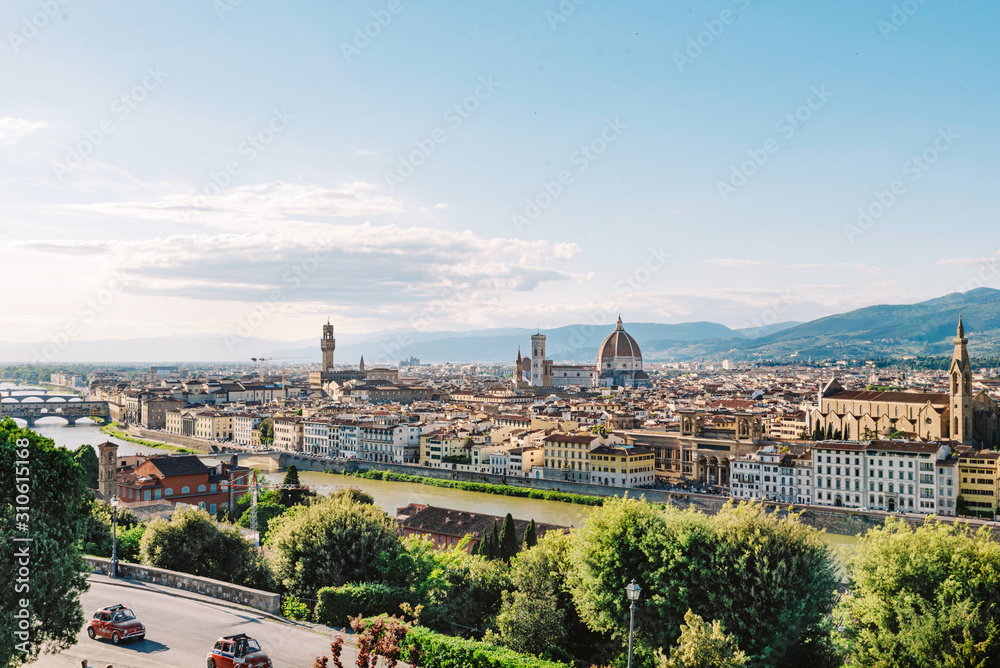Panorama of a beautiful European city in spring. Roofs of houses and domes in Florence Italy. Travelling Europe