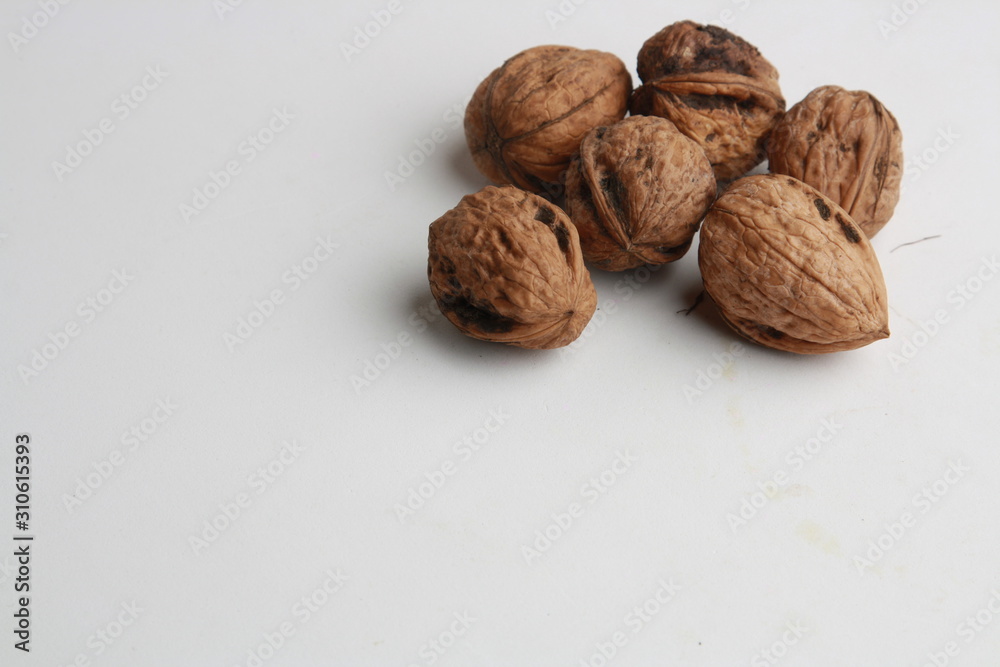 Garlic walnuts in color background Garlic walnuts in color background