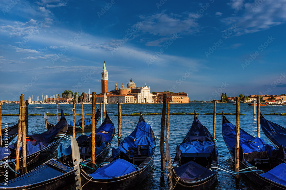 San Giorgo Maggiore (St George) Island and Church in Venice Lagoon seen through gondolas