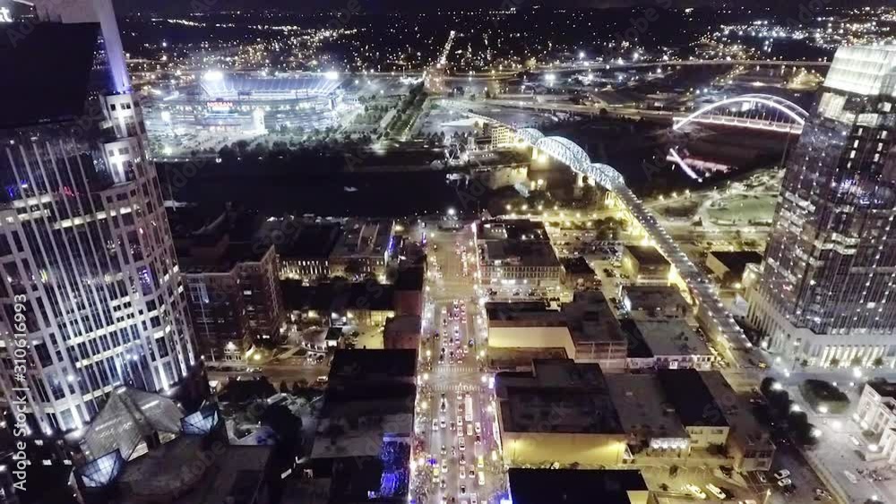 Aerial fly over of busy Broadway traffic in downtown Nashville, Tennessee at night. Aerial fly over of busy Broadway traffic in downtown Nashville, Tennessee at night.