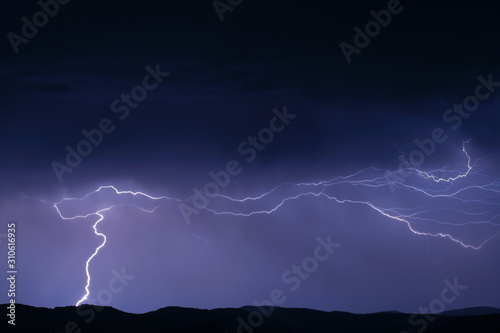 Thunderstorm with lightning on the mountain.