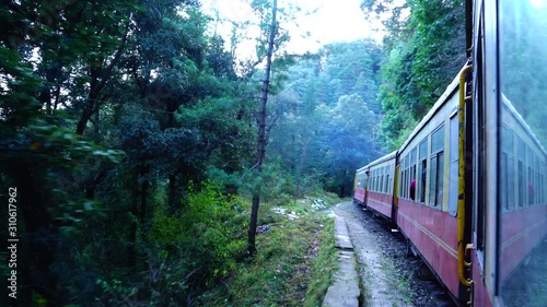 Historic train on the way to the Shimla, UNESCO World Heritage Site, Himachal Pradesh, India. photo