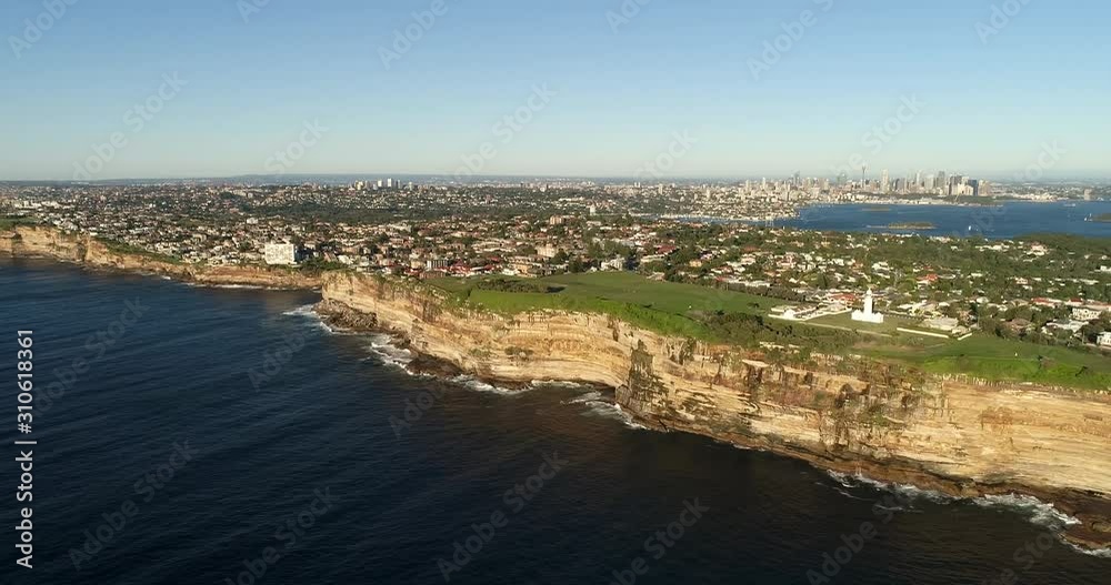 Cliffy coast of Greater Sydney around entrance to Sydney Harbour in wide rotation panoramic view from open Pacific ocean over Macquarie lighthouse. Cliffy coast of Greater Sydney around entrance to Sydney Harbour in wide rotation panoramic view from open Pacific ocean over Macquarie lighthouse.