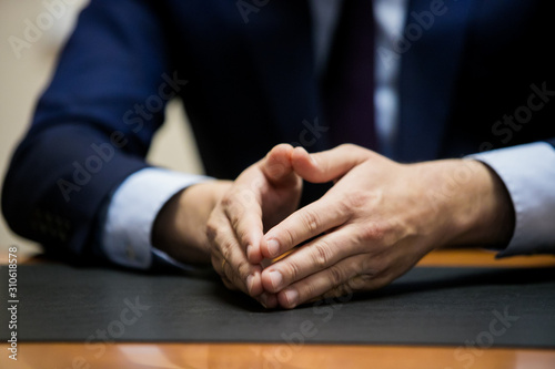 man hand talking in office