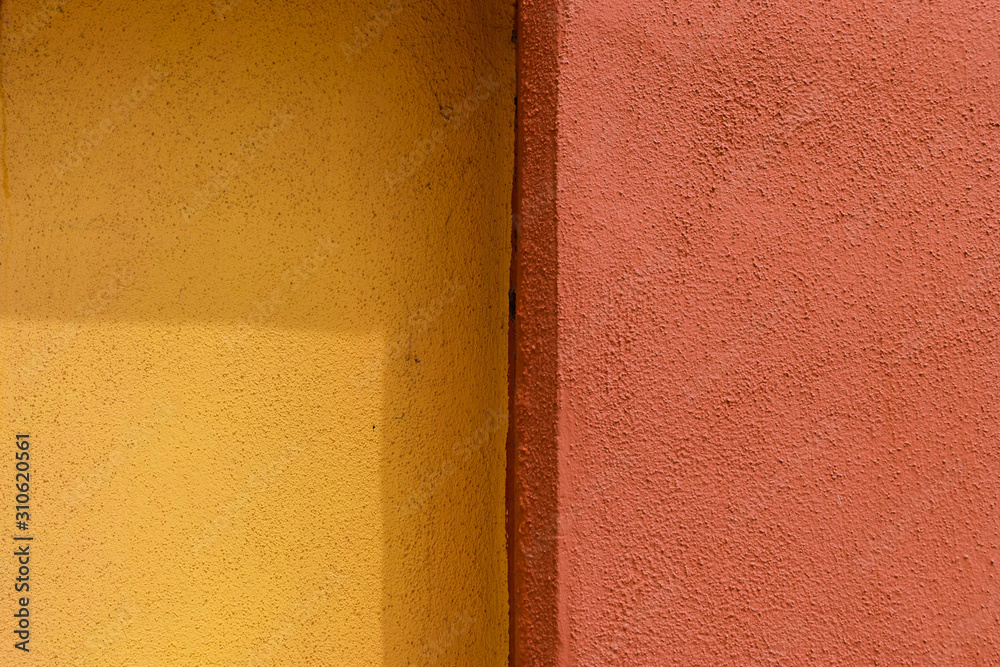Fototapeta premium Plaster texture of yellow and red color - Vertical stripes of different colors