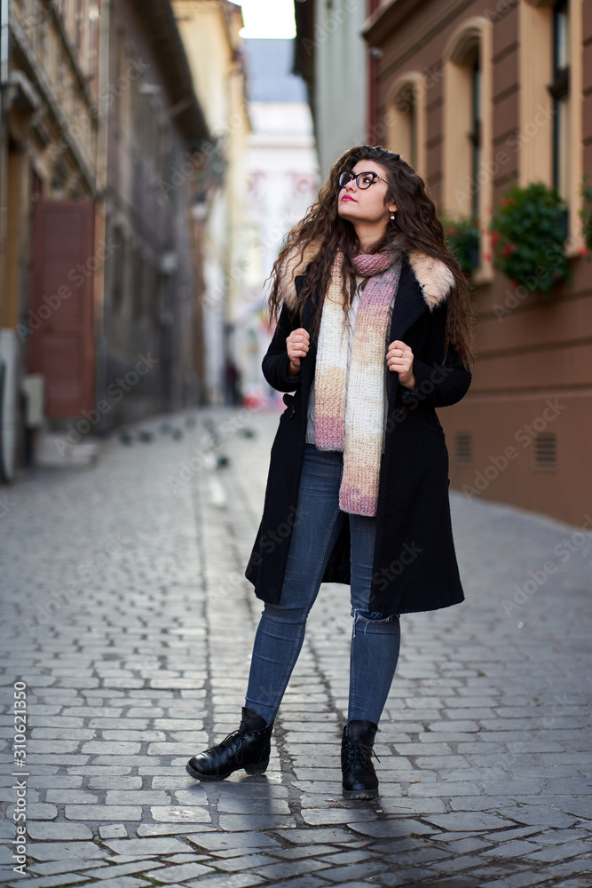 Fototapeta premium Urban portrait of a young woman