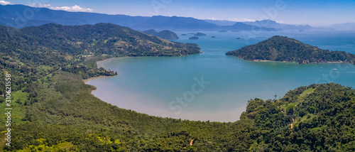 Aerial view panorama of a fantastic bay and islands with Atlantic forest near Tarituba, Green coast, Brazil