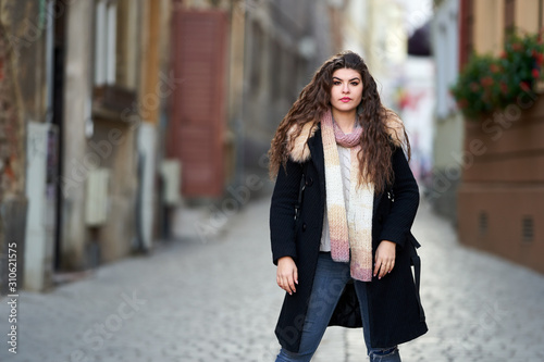 Young tourist with backpack in old town