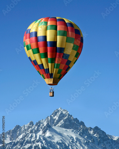 Hot air balloon over the rocky  mountains 