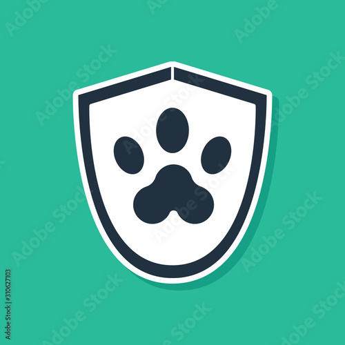 Blue Animal health insurance icon isolated on green background. Pet protection icon. Dog or cat paw print. Vector Illustration