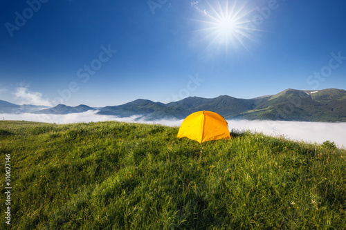 Tourist camping tent in a mountains. Carpathian  Ukraine  Europe. Beauty world.