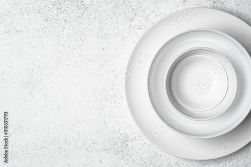 White plates isolated on a light background. Table setting. Top view copy space.