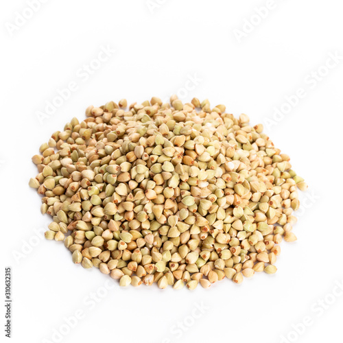 Heap of dried buckwheat seeds isolated on white background.