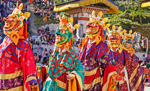 Vászonkép Performers dancers wearing masks in festival in Mongar, Bhutan