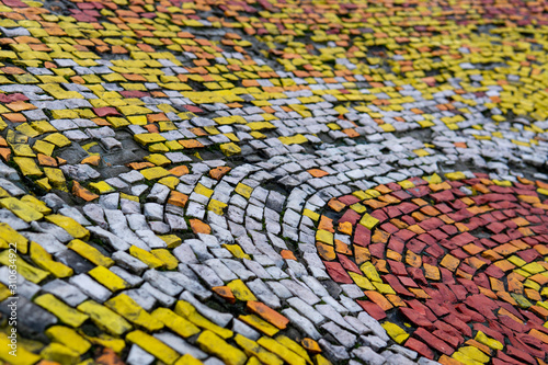 Fragment of an old wall olor mosaic close-up. Smalt..