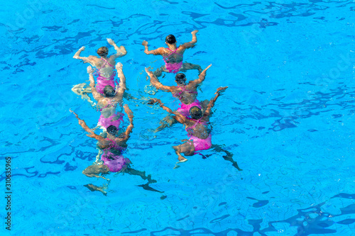 Synchronized Swimming Girls Team Dance Routine Overhead Pool Action