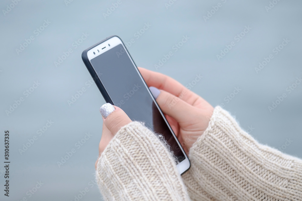 Woman holding a smartphone close up 5