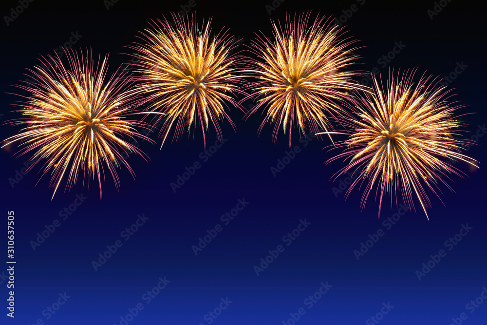 Colorful fireworks celebration and the city night light background.