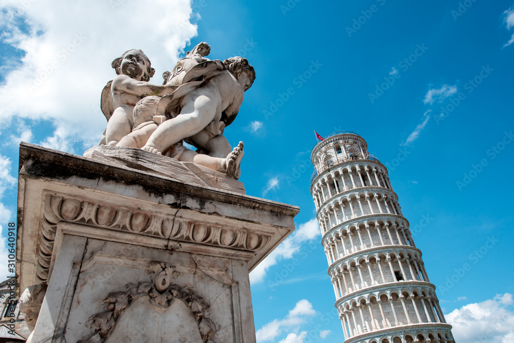 Monument near the famous sloping tower with columns in Pisa, Italy. fascinating exotic amazing places.