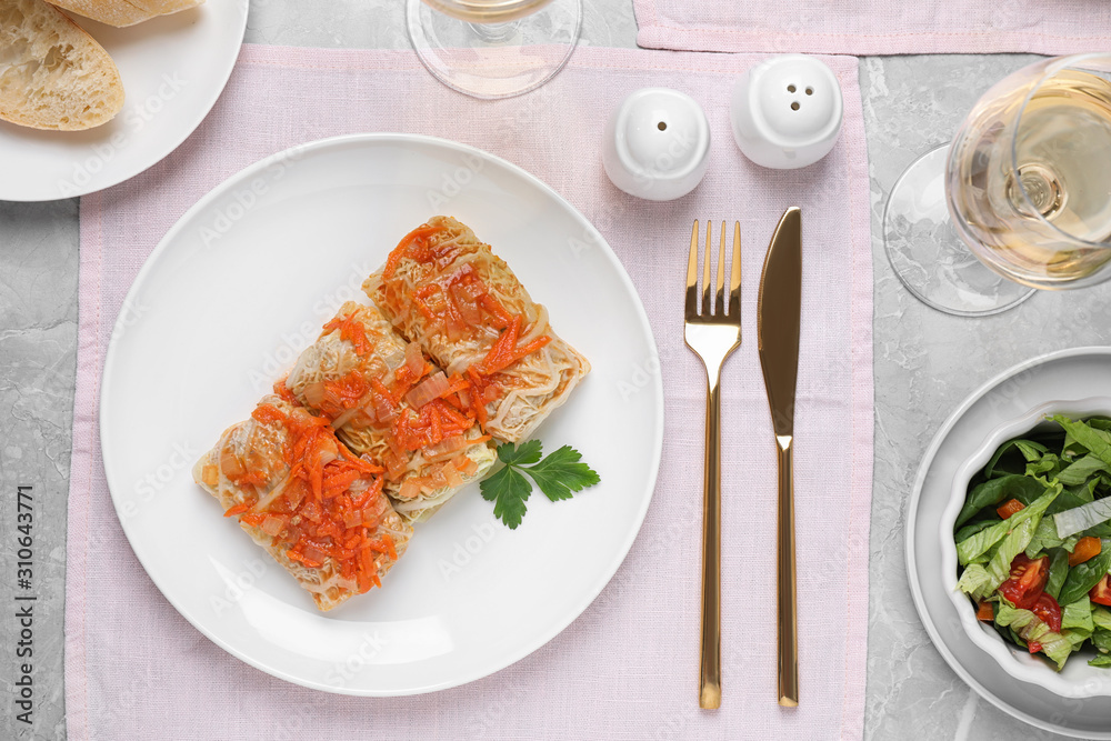 Delicious cabbage rolls served on grey table, flat lay Delicious cabbage rolls served on grey table, flat lay