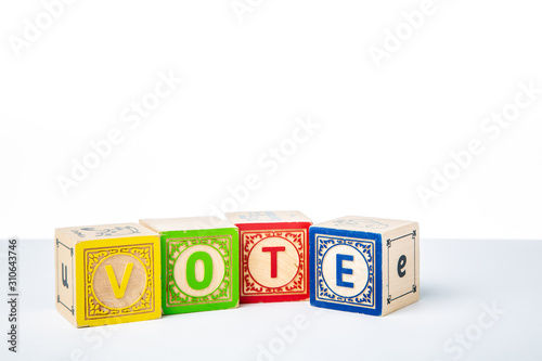 Childrens Wooden Alphabet Blocks Spelling the Word Vote