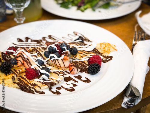 delicious home made pancakes with fresh fruits & chocolate glaze