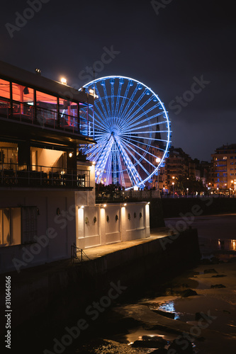 San Sebastian's pier ferris wheel with the lights on after twilight