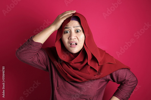 Muslim Woman Confused and Worried Gesture © airdone