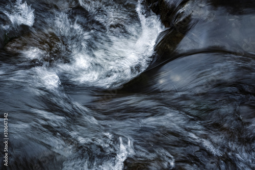 Detail of a wave on a mountain river