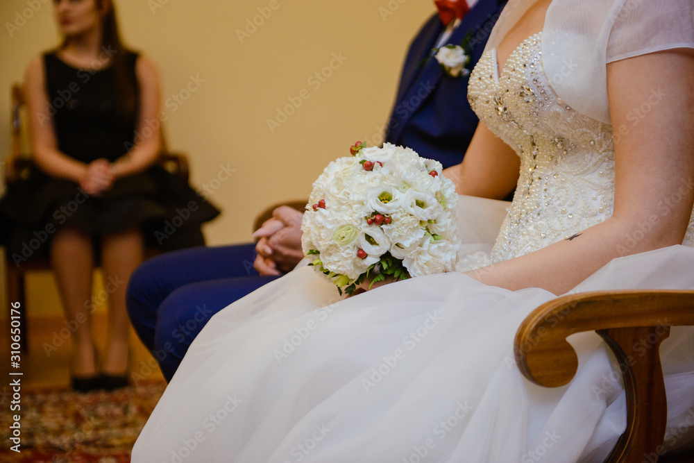 Bride and groom at church wedding during ceremony. Beautiful decoration. Bride and groom at church wedding during ceremony. Beautiful decoration.