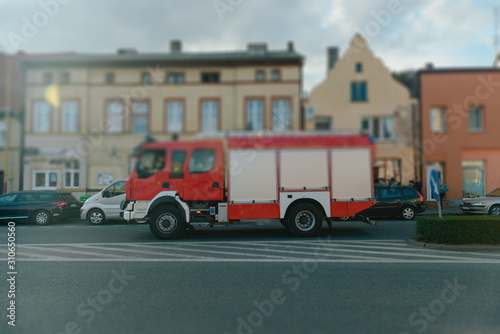 Beautiful wedding couple on outdoor photoshoot with fire truck.