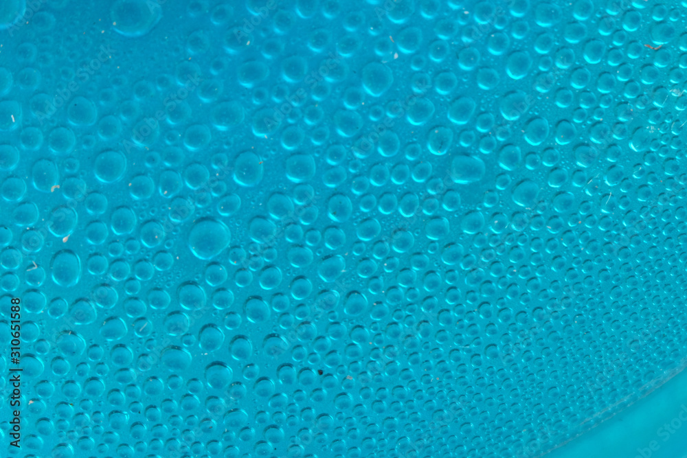 Blue water drops background close up Blue water drops background close up