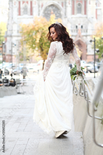 Beautiful bride in white dress with crown
