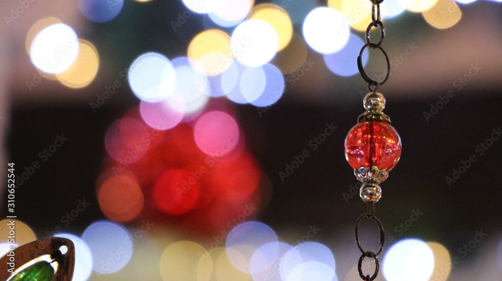 Christmas illuminations with blurred effect. Red & white light sparkle on glitter ornaments. Celebration design. Bright abstract texture. Background colorful holiday night. Blurry xmas festive party. Christmas illuminations with blurred effect. Red & white light sparkle on glitter ornaments. Celebration design. Bright abstract texture. Background colorful holiday night. Blurry xmas festive party.
